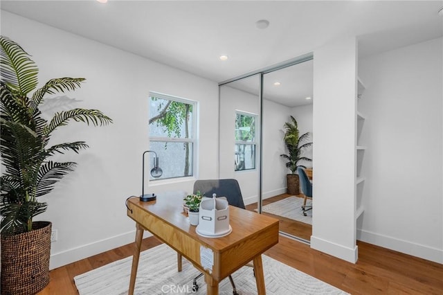 office with hardwood / wood-style flooring