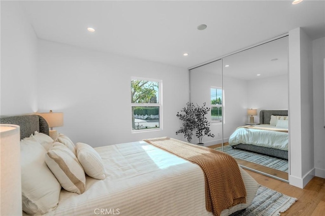 bedroom featuring a closet and light hardwood / wood-style flooring