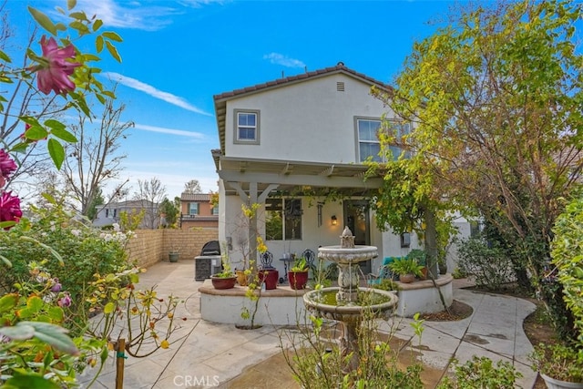 rear view of property with a patio area