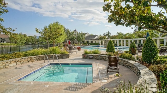 view of pool featuring a patio