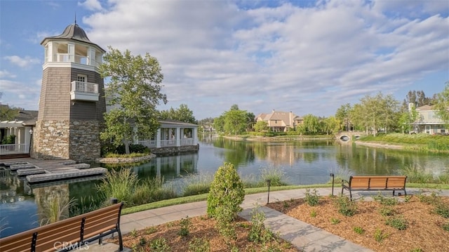 view of community with a water view