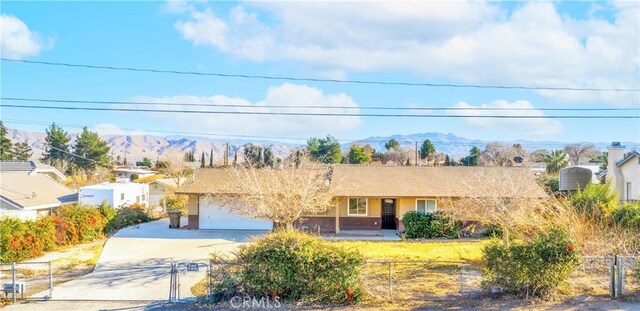 view of front of house with a mountain view and a garage