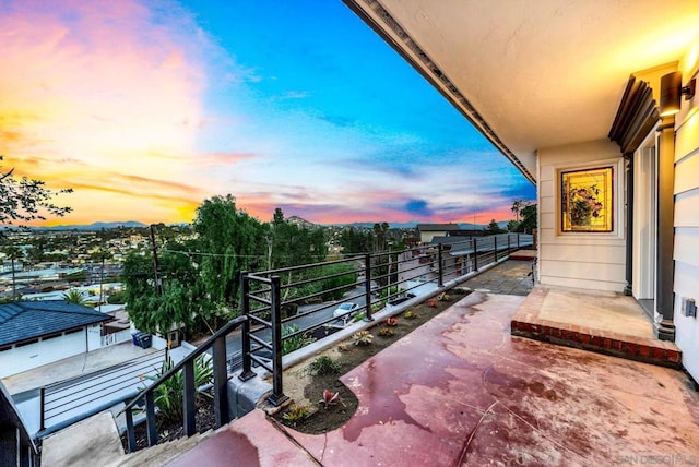 view of balcony at dusk