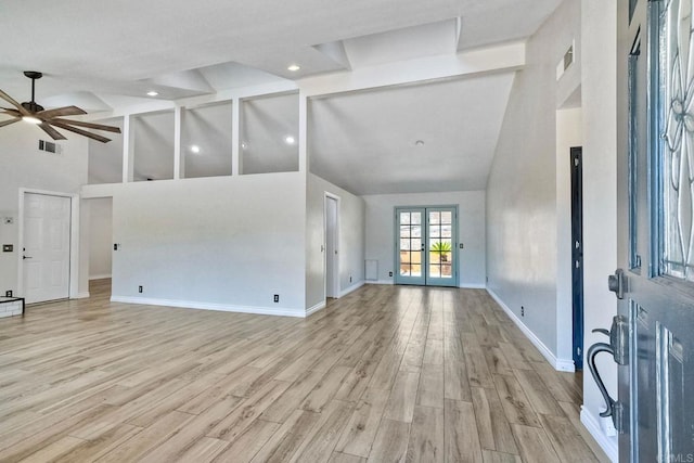 living room featuring ceiling fan, light hardwood / wood-style flooring, french doors, and high vaulted ceiling