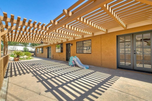 view of patio featuring a pergola and french doors