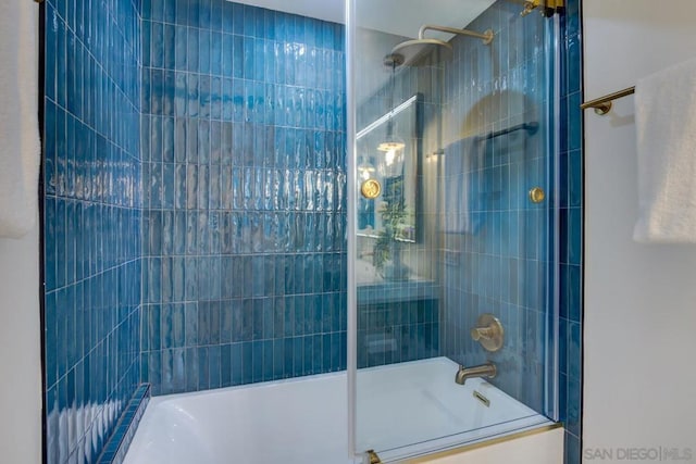 bathroom featuring shower / bath combination with glass door