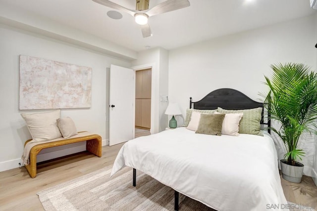 bedroom featuring ceiling fan and light hardwood / wood-style flooring