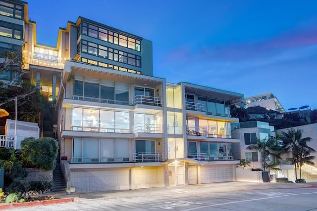 view of outdoor building at dusk