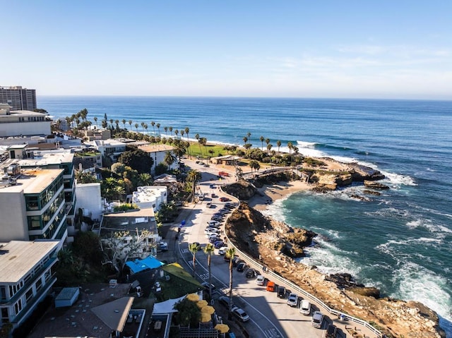 drone / aerial view featuring a water view and a beach view