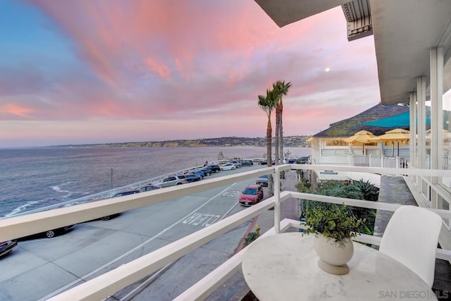 balcony at dusk with a water view