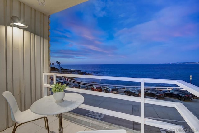 balcony at dusk with a water view