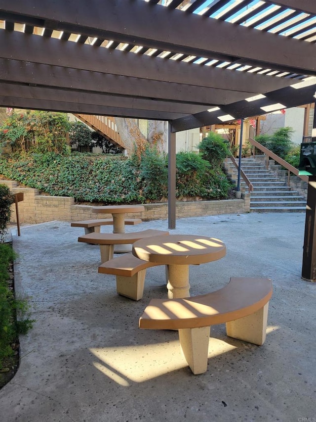 view of home's community featuring a patio area and a pergola