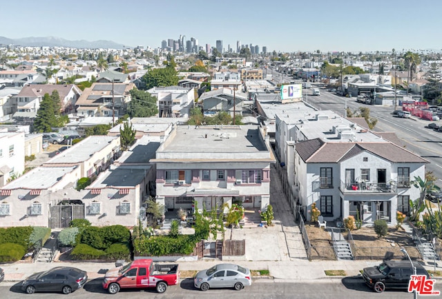 birds eye view of property featuring a mountain view