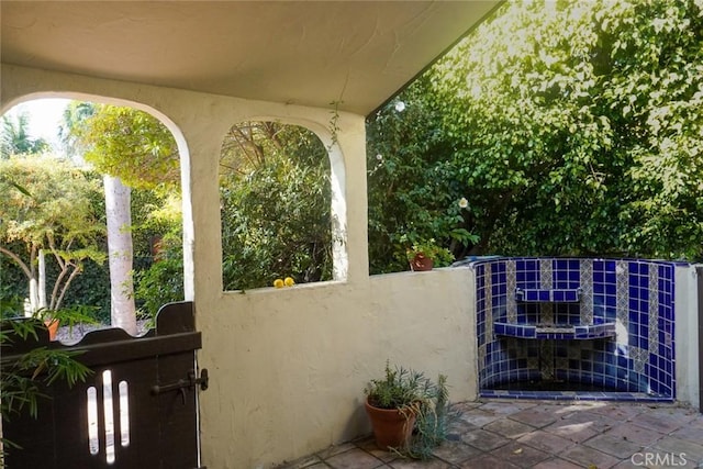 view of patio featuring fence