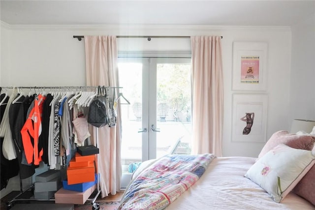 bedroom with access to outside, french doors, and crown molding