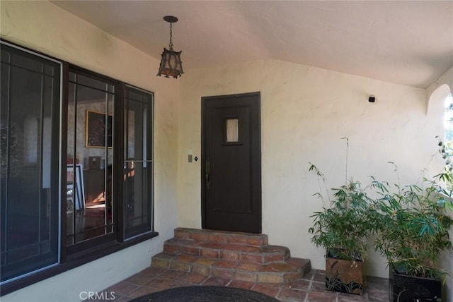 property entrance featuring stucco siding