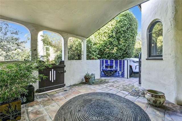 view of patio / terrace featuring fence