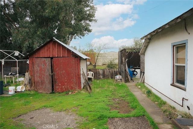 view of outbuilding with a yard