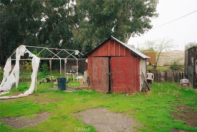 view of outdoor structure featuring a lawn