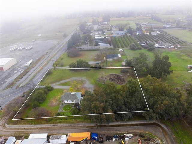 birds eye view of property featuring a rural view