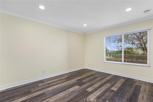 empty room featuring dark hardwood / wood-style floors and ornamental molding