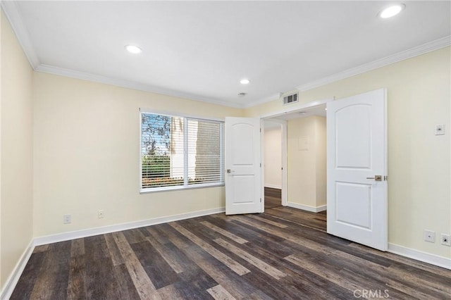 unfurnished bedroom featuring dark hardwood / wood-style floors and crown molding