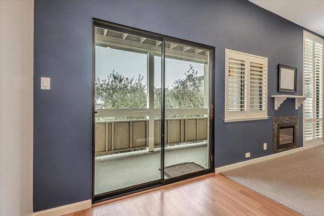 entryway with hardwood / wood-style flooring