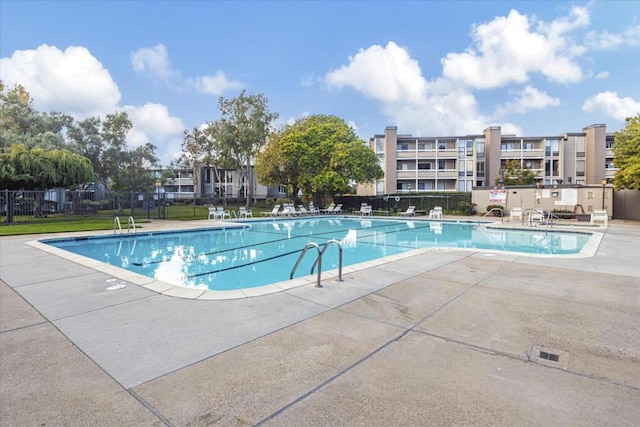 view of swimming pool with a patio area