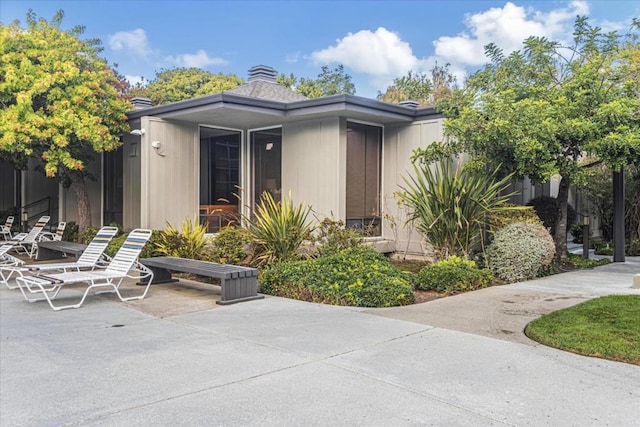 doorway to property featuring a patio area