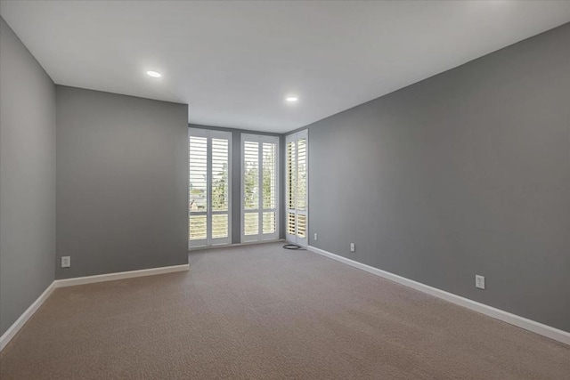 empty room with carpet flooring