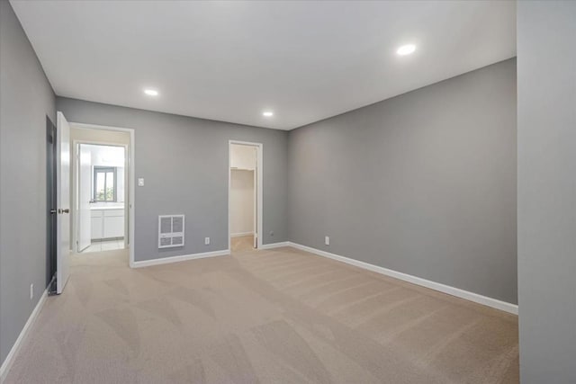 spare room with light colored carpet