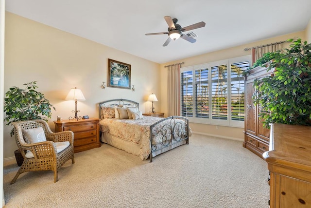 bedroom featuring light carpet and ceiling fan