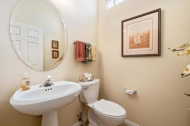 bathroom with toilet and sink