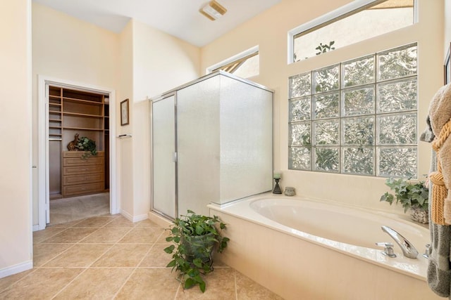 bathroom featuring tile patterned floors and plus walk in shower