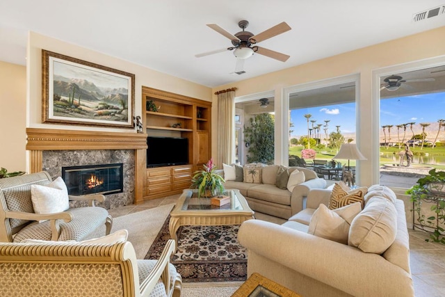 living room with a fireplace and built in shelves