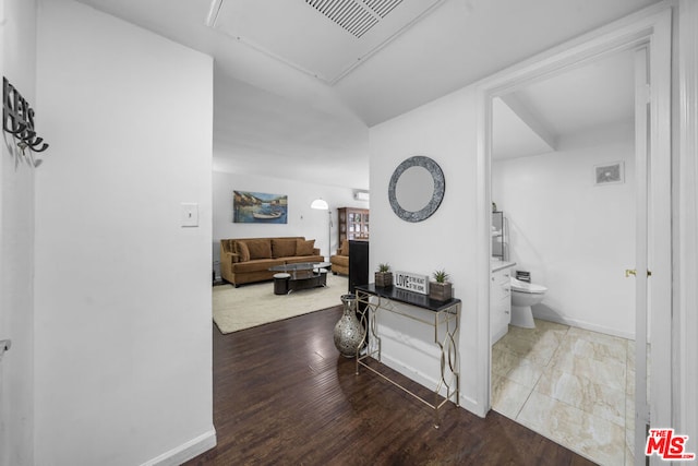 hallway with hardwood / wood-style floors