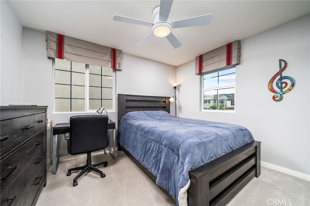 bedroom featuring ceiling fan and light colored carpet