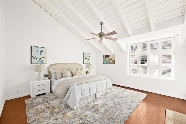 bedroom with ceiling fan, dark hardwood / wood-style floors, high vaulted ceiling, and beamed ceiling