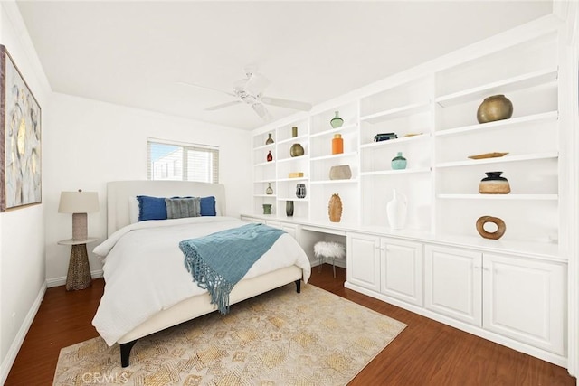 bedroom featuring ceiling fan and dark hardwood / wood-style flooring