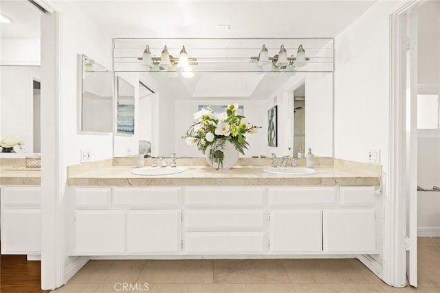 bathroom featuring tile patterned floors and vanity