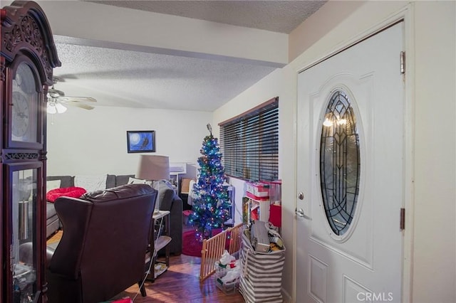 office featuring a textured ceiling and ceiling fan