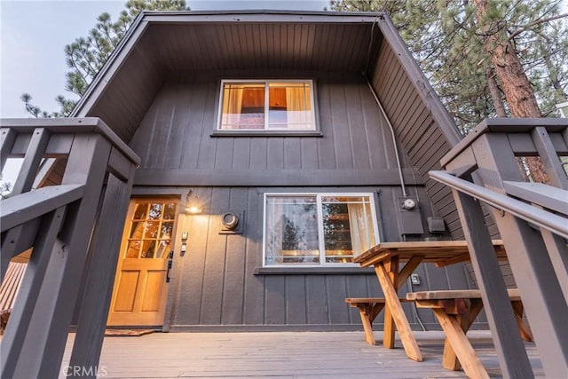 rear view of house featuring a deck