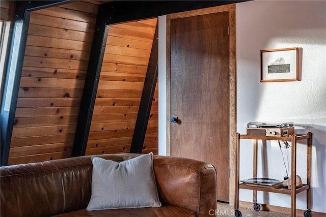 sitting room featuring wood walls