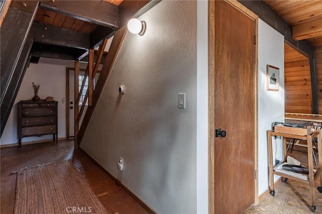 stairs with wood ceiling and beamed ceiling