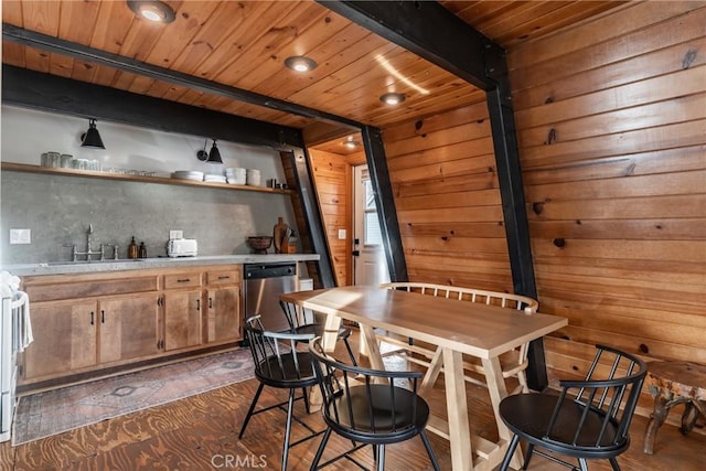 dining space featuring bar area, beamed ceiling, wooden walls, and wood ceiling