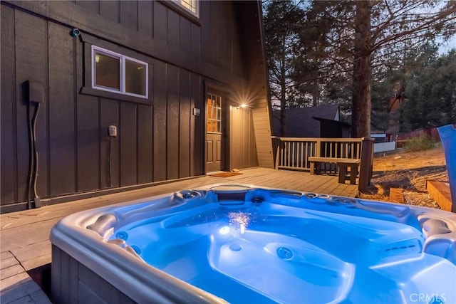 exterior space with a hot tub