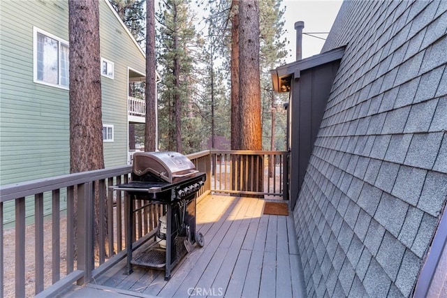 wooden terrace with area for grilling