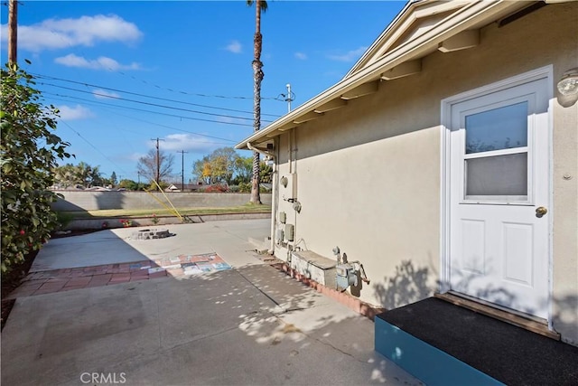 view of side of home with a patio