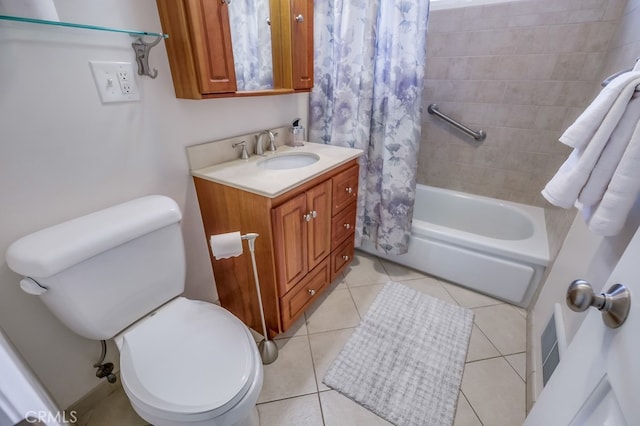 full bathroom featuring toilet, tile patterned floors, vanity, and shower / bath combo with shower curtain