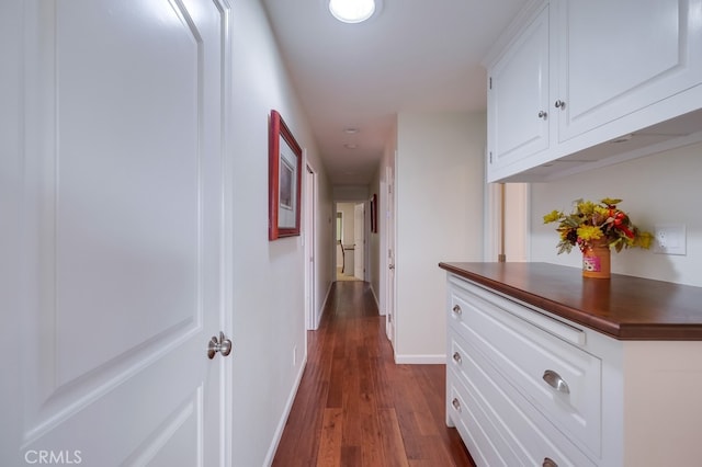 hallway with dark hardwood / wood-style floors